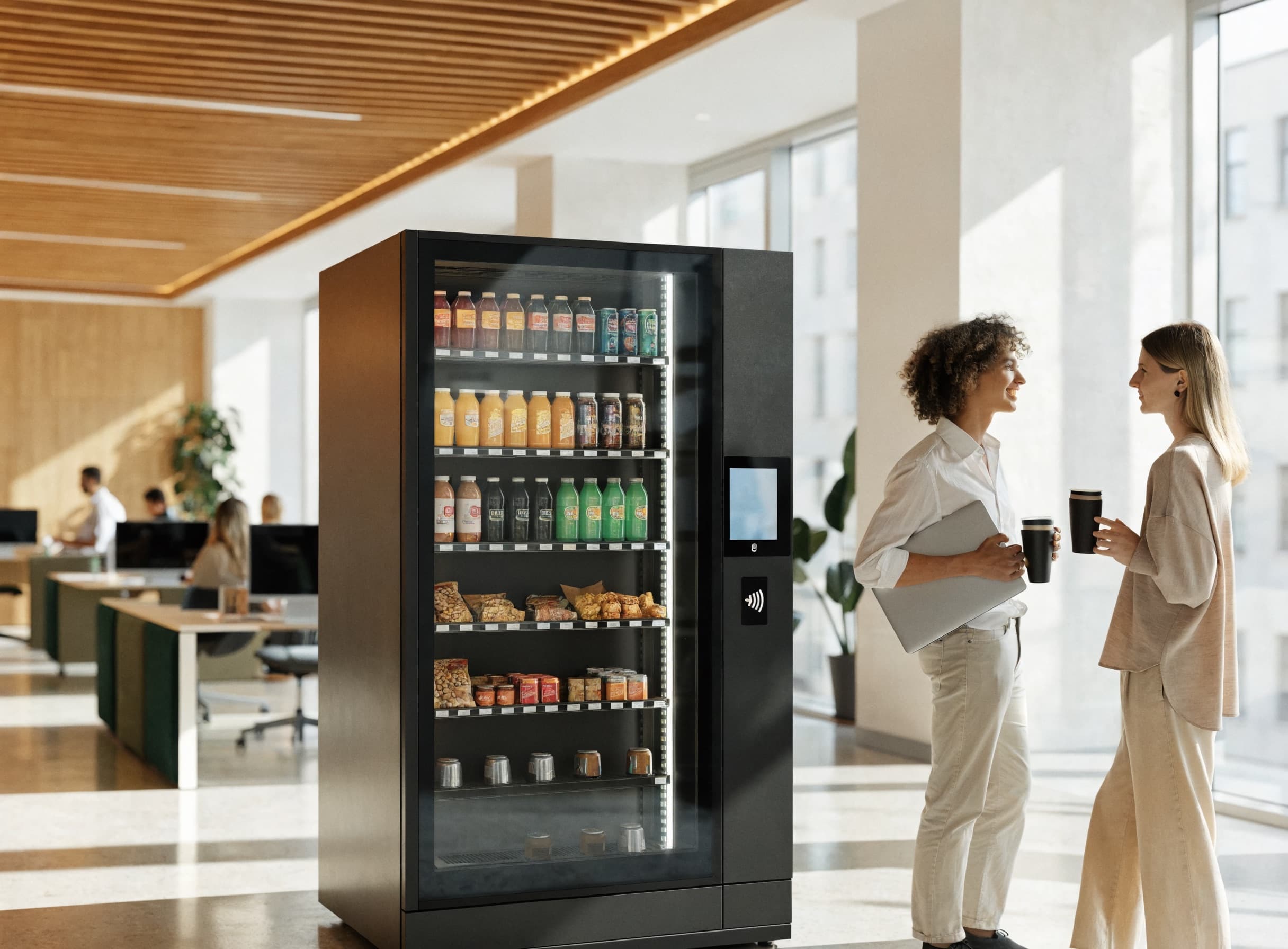 Smart vending micromarket in a bright modern open plan office break area